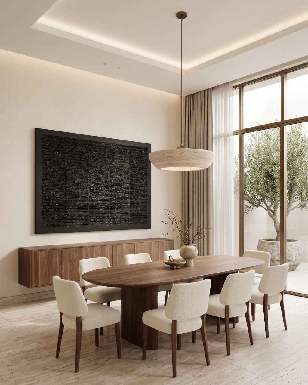 A modern dining room featuring a dark wood oval table, eight cream upholstered dining chairs with dark wood legs, a round woven pendant light, a built-in wood sideboard, and a large black textured wall art piece.