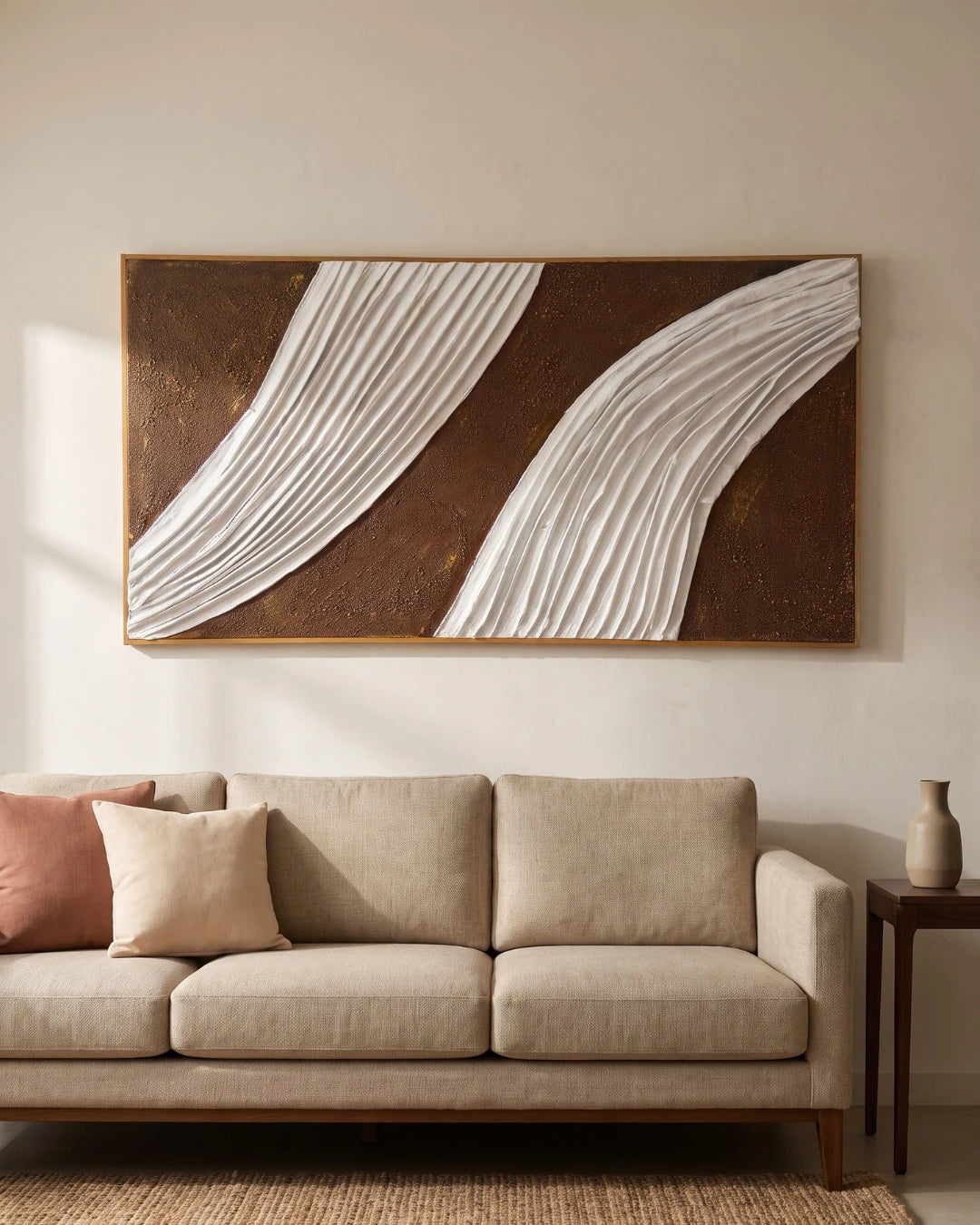 Cascade brown and white textured painting hanging above a sofa in a modern living room
