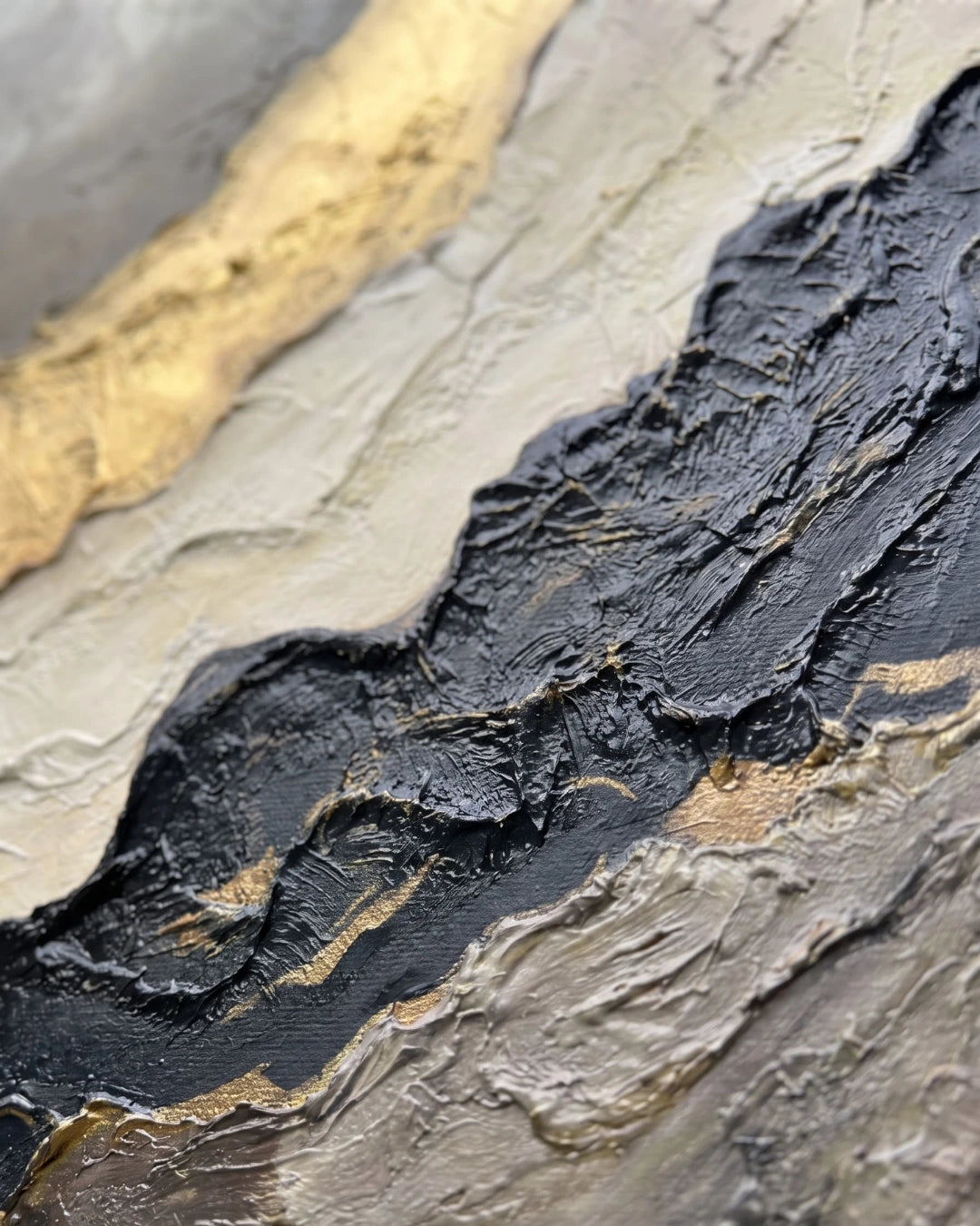 Close-up of Gold Vein canvas showing raised gold leaf and black fractured texture