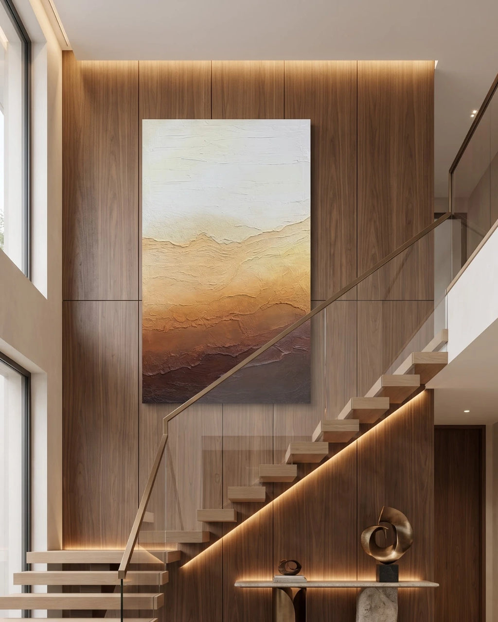 Horizon gradient textured painting hanging on a tall staircase wall in a modern home