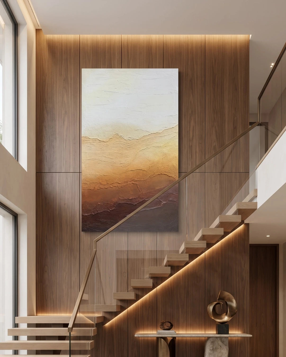 Horizon gradient textured painting hanging on a tall staircase wall in a modern home