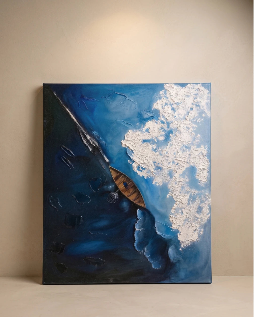Aerial textured painting of a wooden kayak on deep blue ocean with raised white foam wave, handmade canvas wall art
