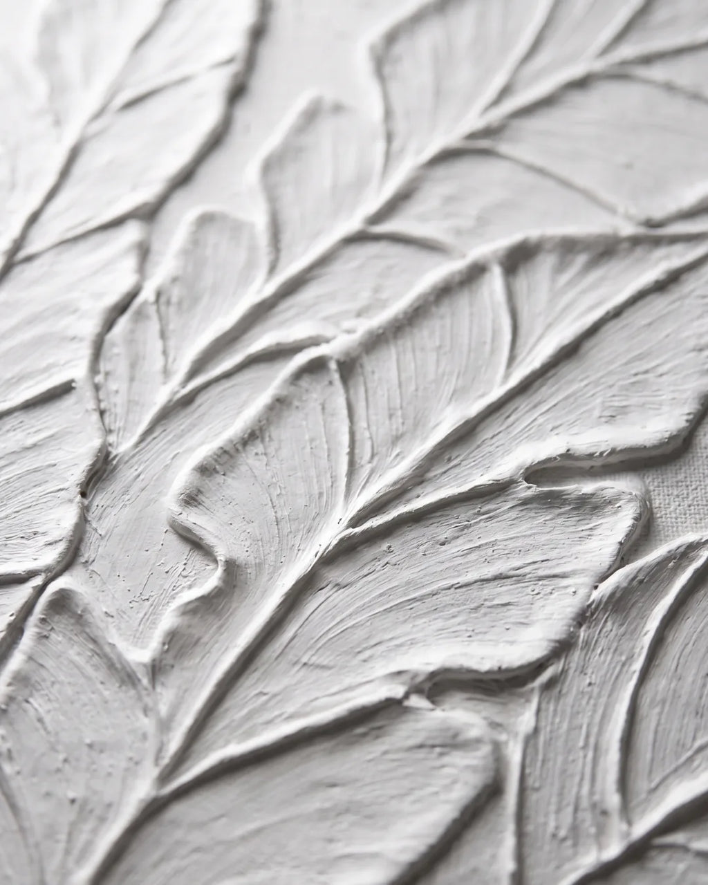 Close-up of raised white plaster on Palm Study canvas showing hand-combed leaf veining
