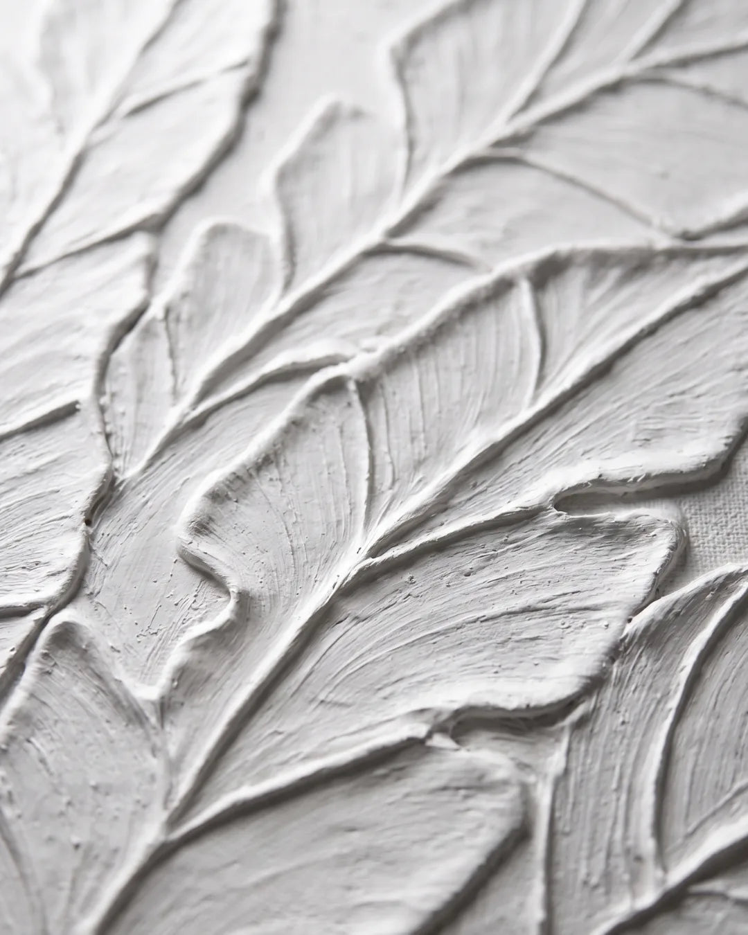Close-up of raised white plaster on Palm Study canvas showing hand-combed leaf veining
