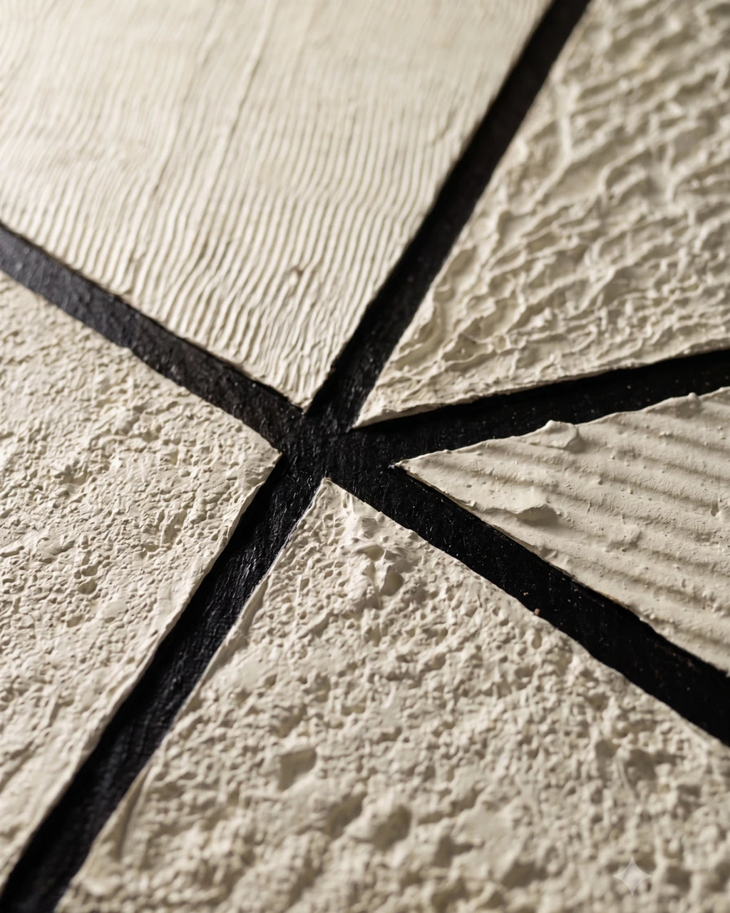Close-up of ribbed and stony cream texture on Prism canvas showing hand-built plaster layers