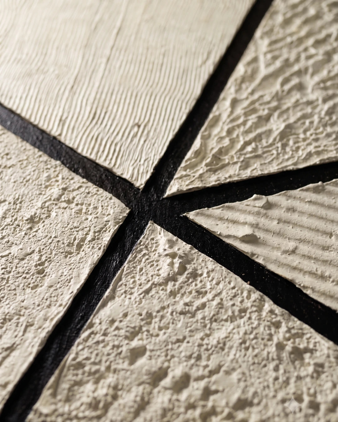 Close-up of ribbed and stony cream texture on Prism canvas showing hand-built plaster layers
