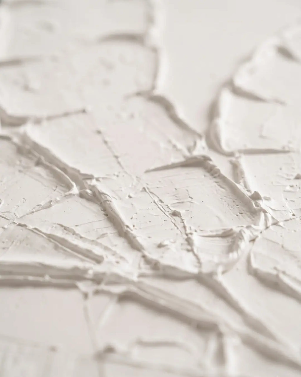 Close-up of raised white plaster on Quiet Banana Leaf canvas showing carved leaf spine and split edges