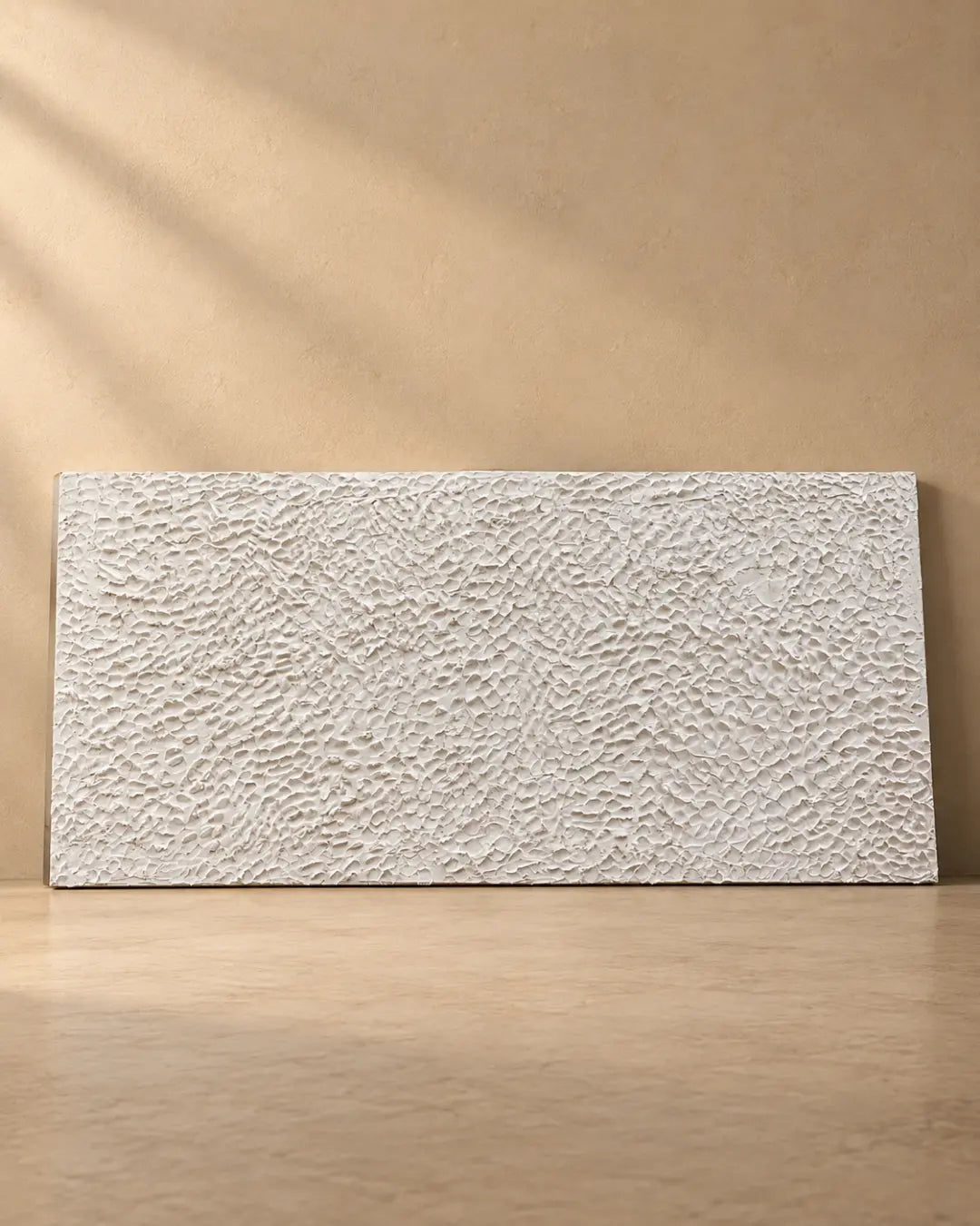 Ivory textured wall art with dense hand-carved crackled relief on plain background, handmade canvas painting