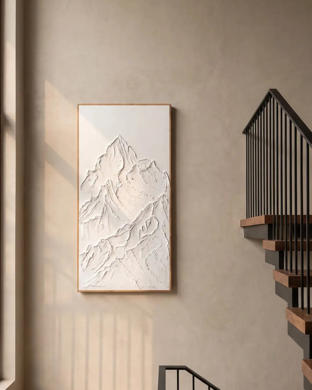 White Peak sculptural mountain painting hanging on a stairwell wall in a modern home