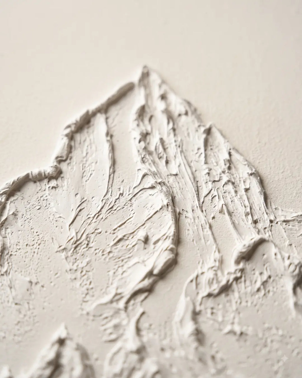 Close-up of raised white plaster on White Peak canvas showing hand-sculpted mountain ridges