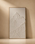 White sculptural mountain textured wall art on plain background, hand-built raised plaster relief, handmade canvas painting